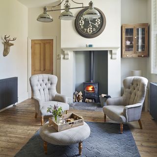 sitting area with fireplace and armchair