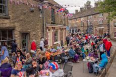 HAYFIELD, ENGLAND - JUNE 04: General view of the Platinum Jubilee street party on Church Street on June 04, 2022 in Hayfield, High Peak, England. The Platinum Jubilee of Elizabeth II is being celebrated from June 2 to June 5, 2022, in the UK and Commonwealth to mark the 70th anniversary of the accession of Queen Elizabeth II on 6 February 1952. (Photo by Anthony Devlin/Getty Images)