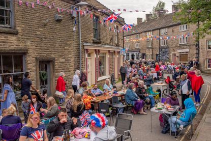 HAYFIELD, ENGLAND - JUNE 04: General view of the Platinum Jubilee street party on Church Street on June 04, 2022 in Hayfield, High Peak, England. The Platinum Jubilee of Elizabeth II is being celebrated from June 2 to June 5, 2022, in the UK and Commonwealth to mark the 70th anniversary of the accession of Queen Elizabeth II on 6 February 1952. (Photo by Anthony Devlin/Getty Images)