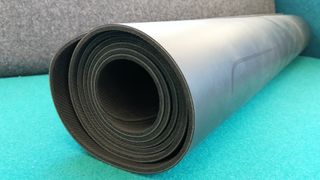 Liforme yoga mat, rolled up, side view