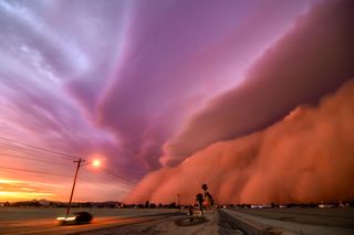 An epic dust storm bears down on Phoenix, Arizona. Photographer Tina Wright Writes: "This was one of the top two largest haboobs (dust storms) ever recorded in the state of Arizona. At the point of this photo it was fully mature, towering over a mile high with winds in excess of 80 miles per hour. The sun was setting, giving the dust wall it's deep pink hue. It was a truly incredible sight to see!"