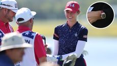 Nelly Korda chats to her caddie during the Solheim Cup