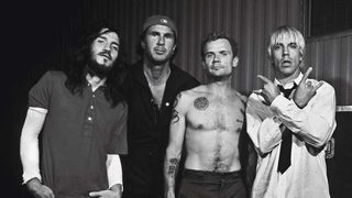 Red Hot Chili Peppers posing backstage