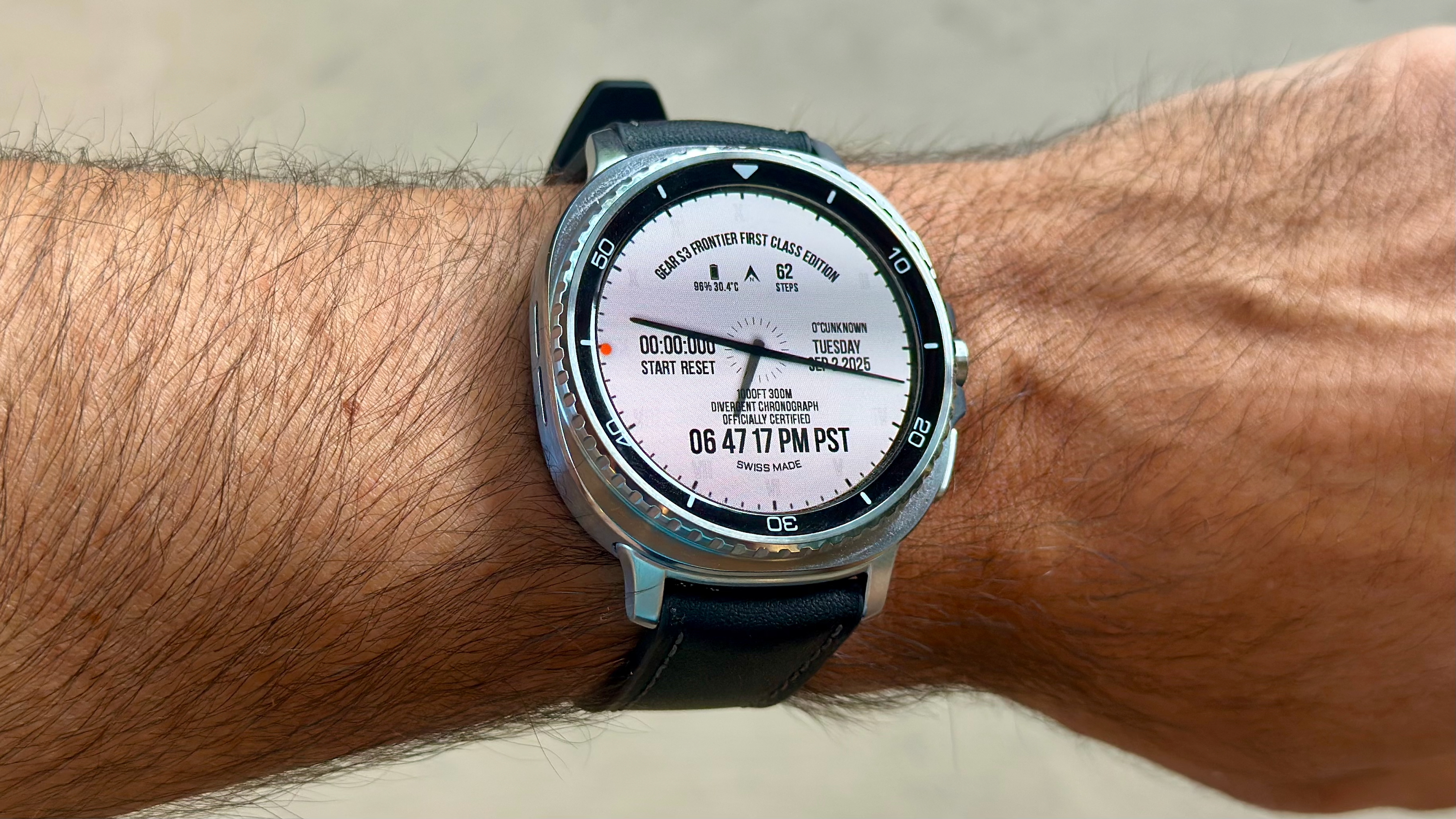 The Samsung Galaxy Watch 8 Classic on a person's wrist, showing a custom watch face from the WatchMaker app of a Samsung Gear S3 watch.