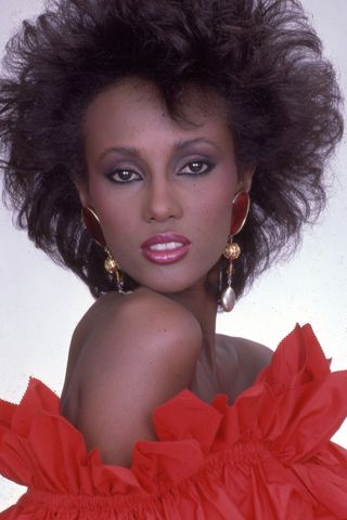 Iman pictured wearing a diffused smoky eyeshadow and a pink lipstick