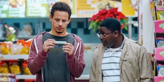 Eric Andre and Lil Rel Howery looking at a chinese finger trap in Bad Trip