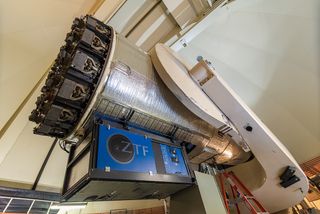 The Zwicky Transient Facility (ZTF) instrument being installed on the 48-inch Samuel Oschin Telescopeat Palomar Observatory. The large-format CCD camera at the heart of ZTF is located inside the telescope tube, at the focus of the primary mirror.