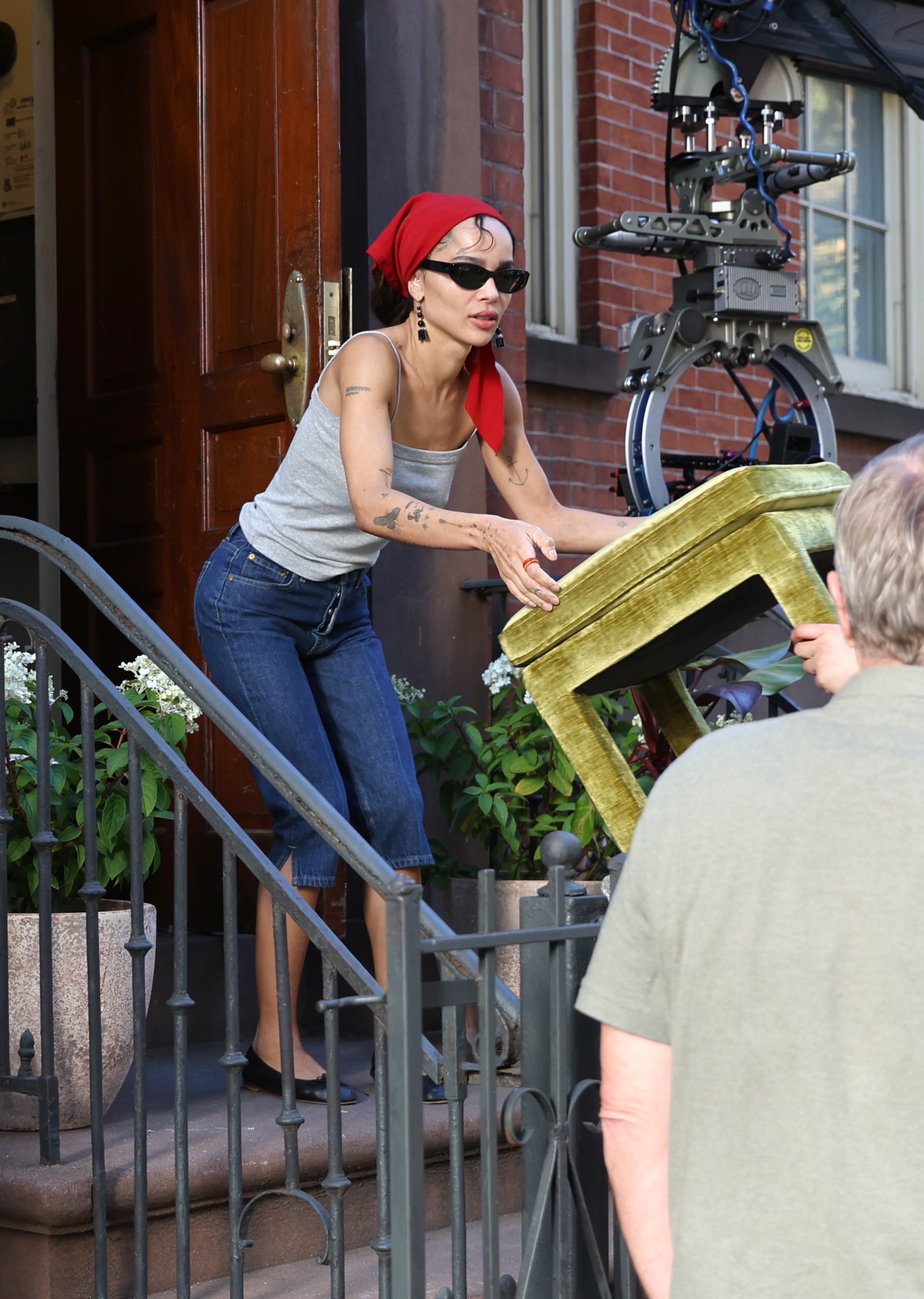 Zo&amp;euml; Kravitz styled the red-and-gray color combination trend on the set of 'Die Alive' in NYC