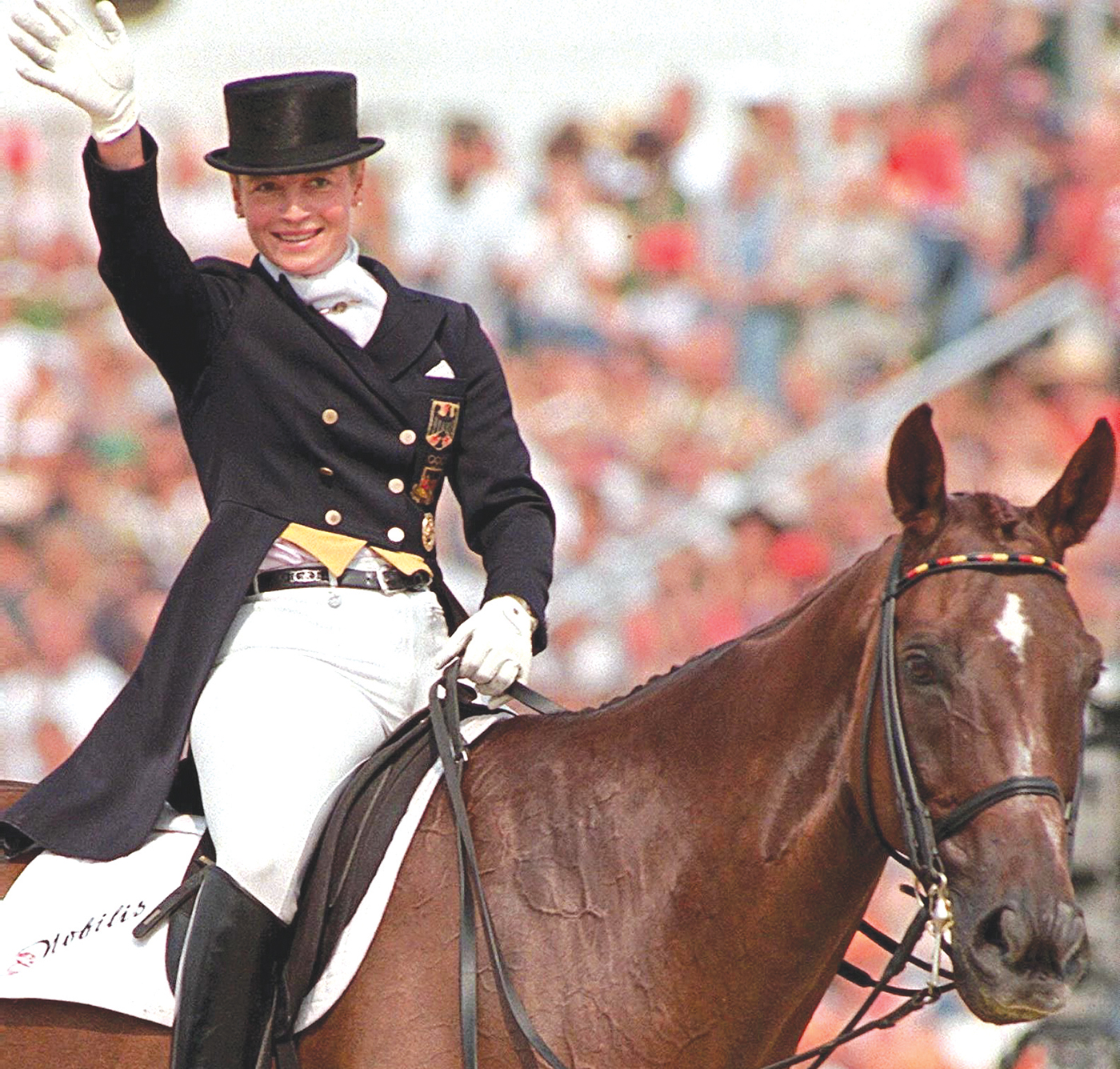 Atlanta '96 double Olympic Champion Isabell Werth of Germany on her horse &amp;quot;Gigolo&amp;quot; wave to the crowd after her free program dressage at the European Championships in Dressage in Verden, 17 August. Werth with her performance overtook Dutch Anky van Grunsven |