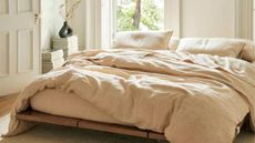 Best linen duvet covers on bed close up with duvet inset and pillows 