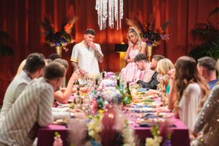 Ella and JJ stood at the head of the table during a MAFS dinner party