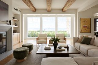 coastal living room with wooden beams and neutral furniture