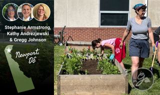 Two people work in a raised garden bed by an outline of the state of Delaware