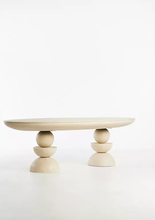 Sculptural double pedestal dining table from Anthropologie.