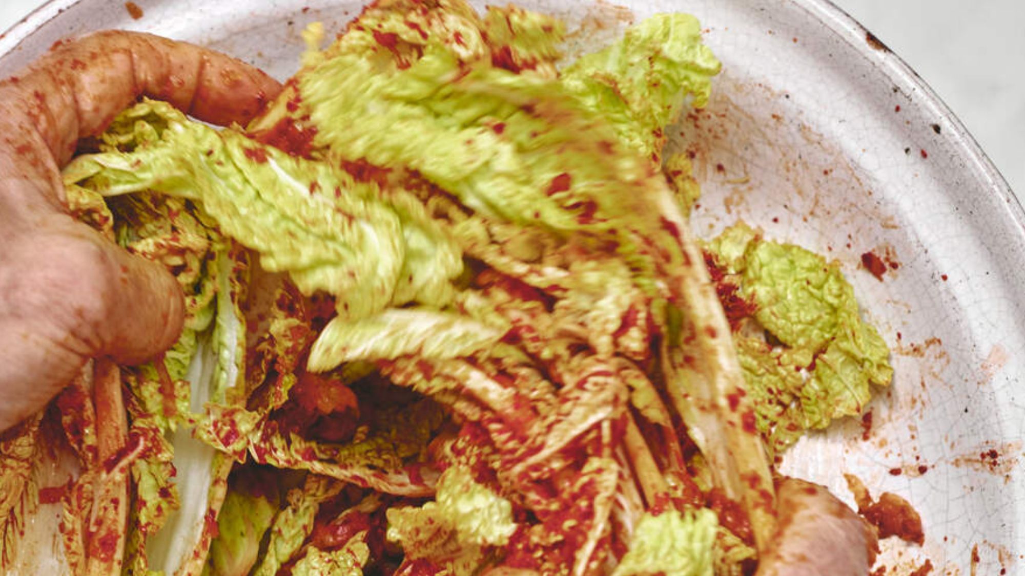 kimchi being tossed