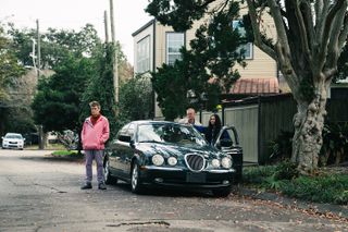 Film still from 'Kinds of Kindness' showing buildings and architecture