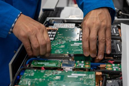 Lab technician working on Frontier compute node