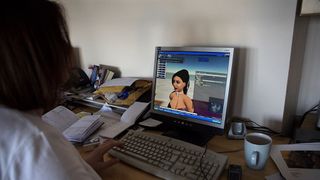 A woman using her avatar on Second Life