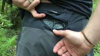 Close up photo of large rear pocket unzipped