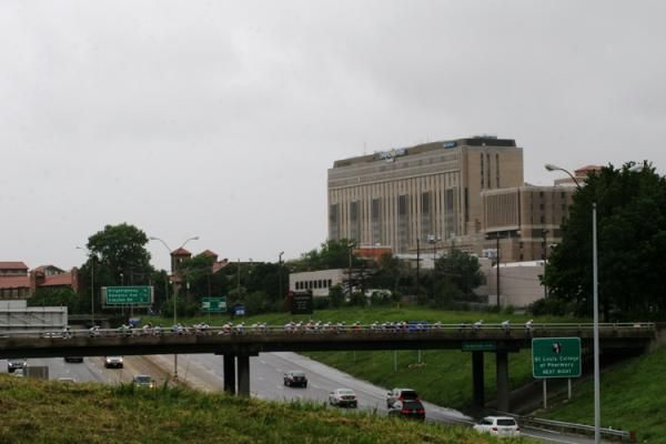 The peloton heads over the bridge