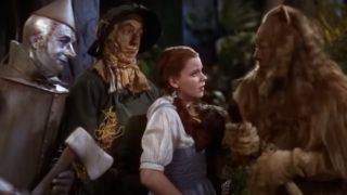 Dorothy with the Tin Man, The Scarecrow, and the Cowardly Lion in The Wizard of Oz