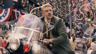 Boyd Holbrook atop motorcycle during parade in Indiana Jones and the Dial of Destiny