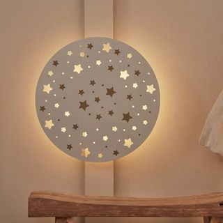 white circle wall light with stars cut out