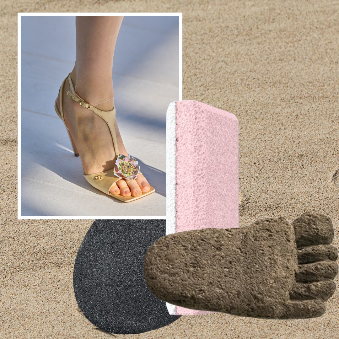 smooth feet on a sandy background with pumice stones