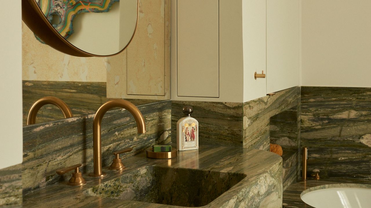 a green marble countertop in bathroom