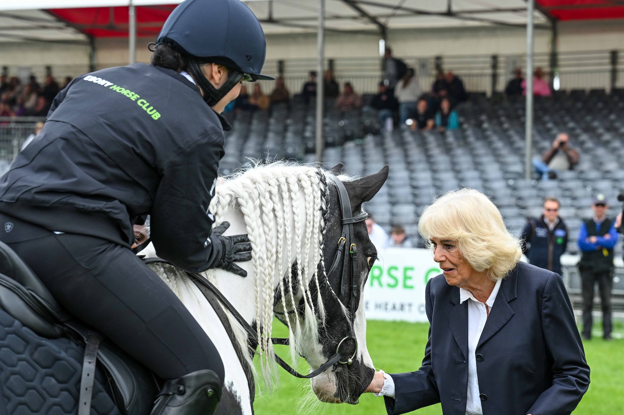 The Queen speaking to an Ebony Horse Club rider in the main Badminton arena