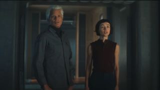 Timothy Olyphant and Sydney Chandler stand together in a hallway in Alien: Earth.