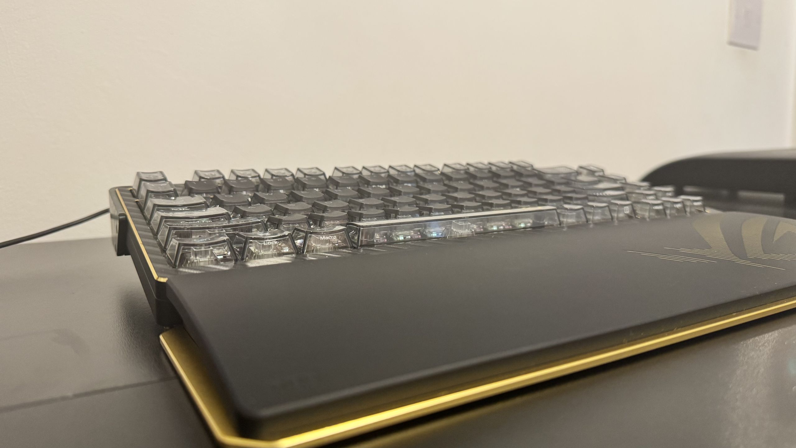 Asus ROG Azoth Extreme Edition 20 from the front left hand side, on a table