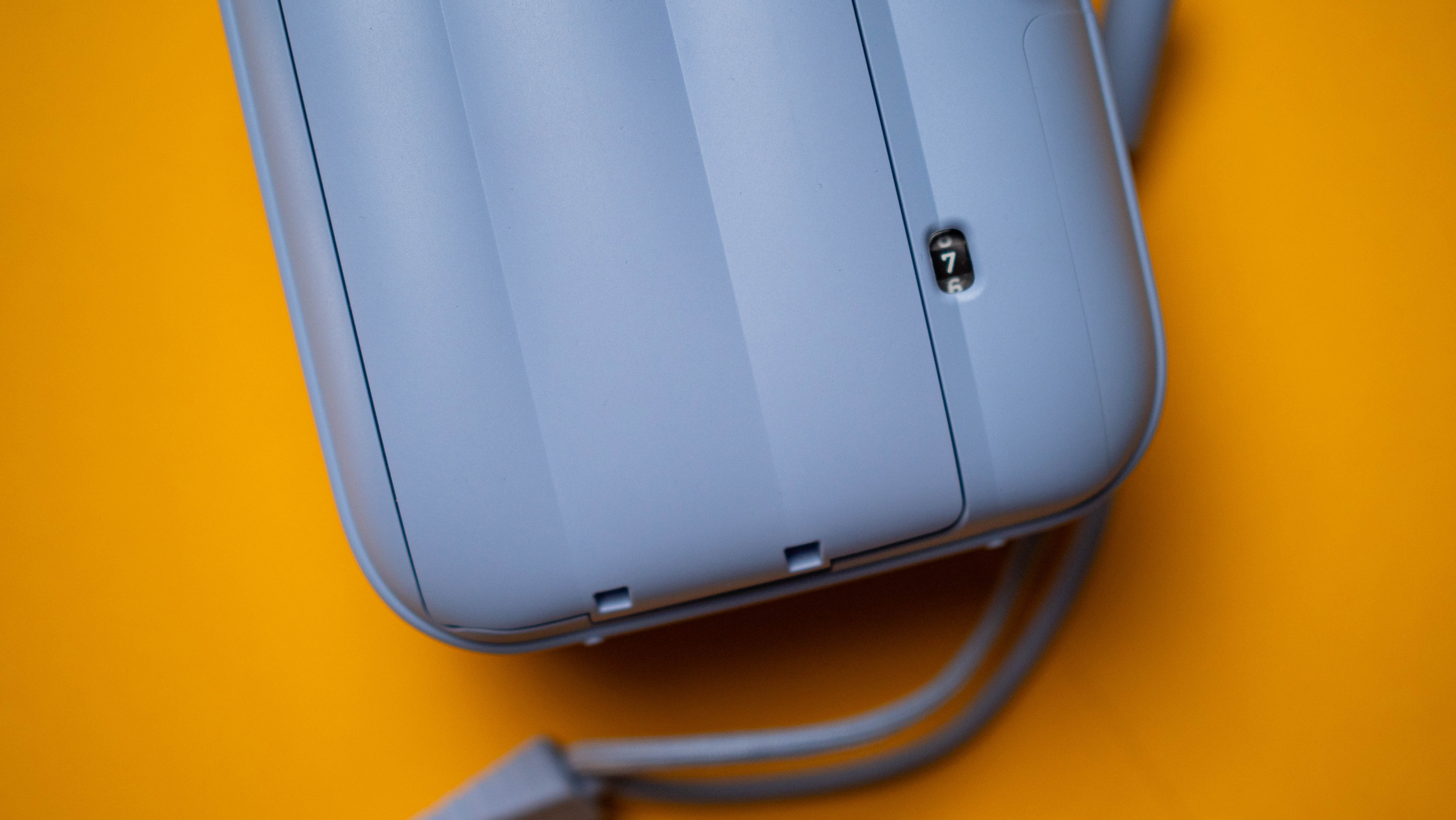 Fujifilm Instax Mini 13 instant camera against a yellow colored sheet