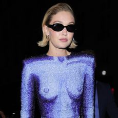 Gigi Hadid in Paris wearing a balmain naked dress with gentle monster sunglasses