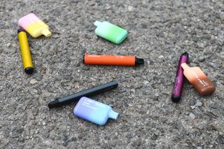 Disposable vapes lying on the pavement
