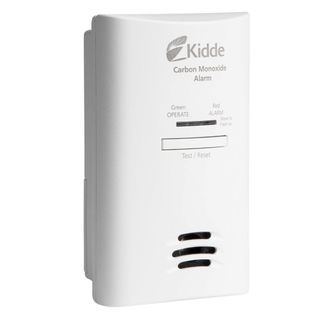 A white plug-in carbon monoxide alarm