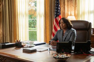 angela Bassett as President Evelyn Mitchell sitting at her desk in the oval office in zero day