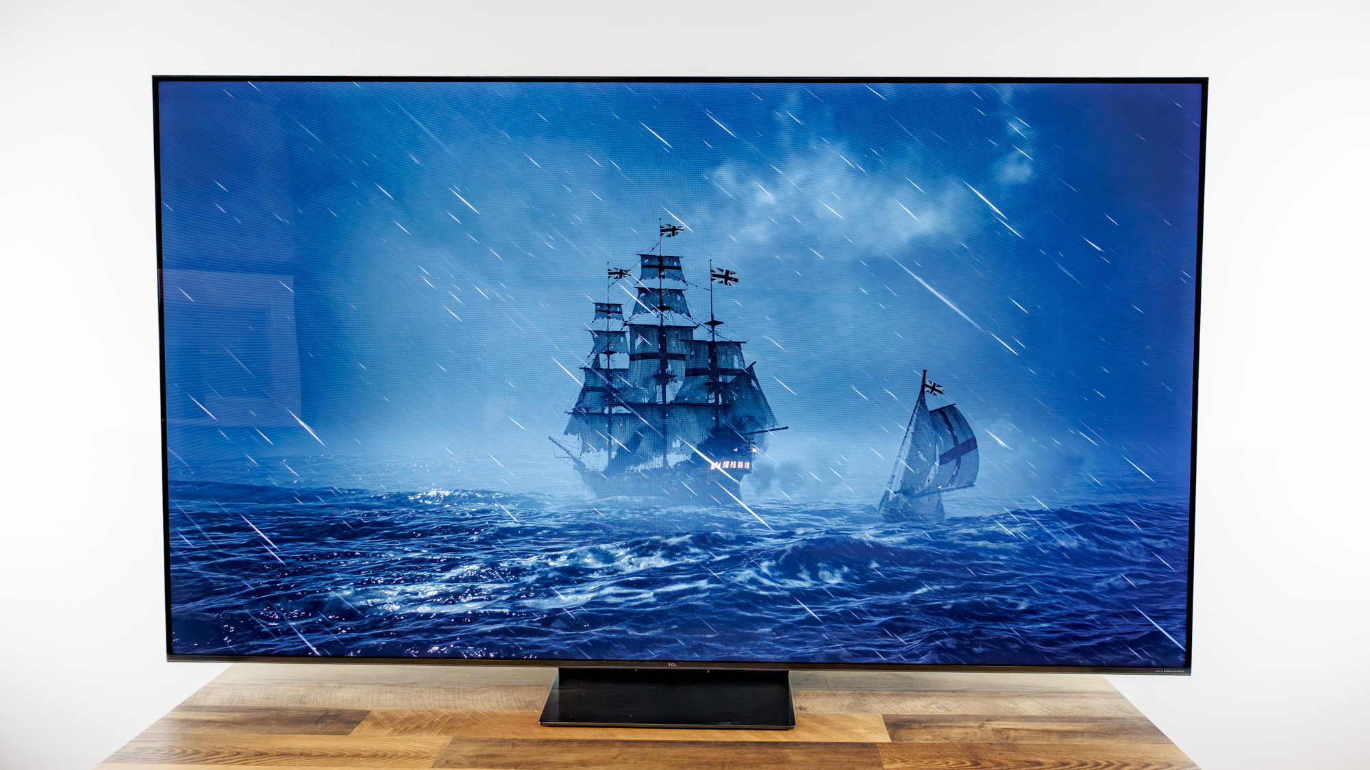 TCL QM7L 75-inch TV on a desk