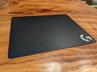 The Logitech G440 mouse pad on a wooden table