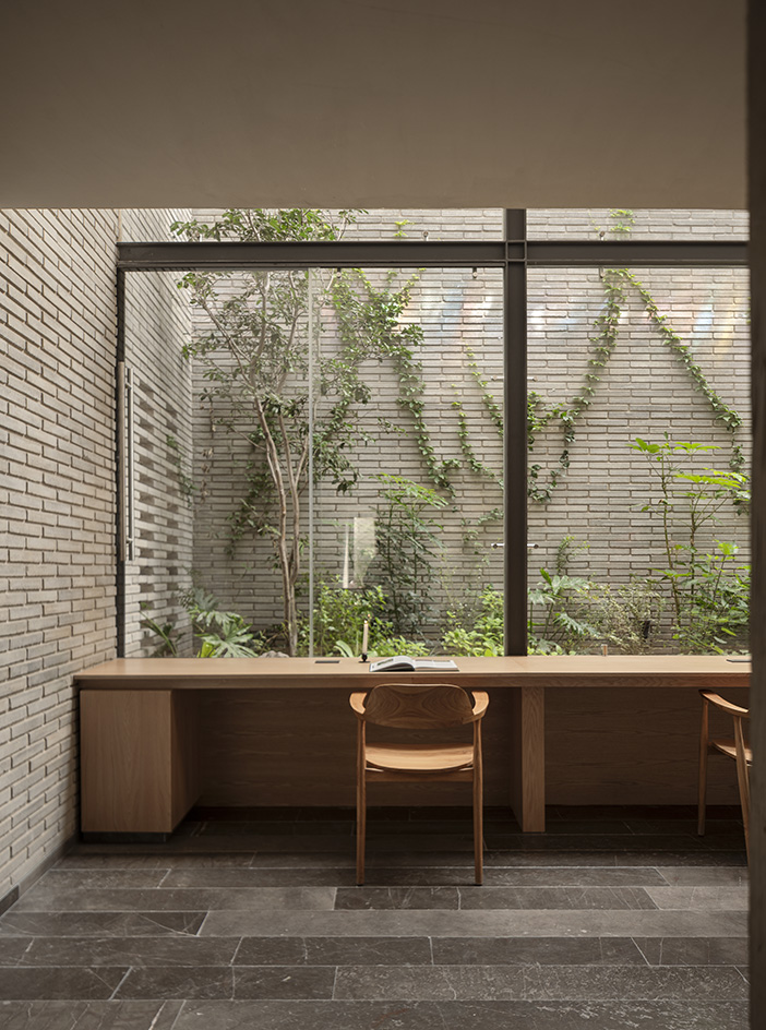 Mexican house designed as a refuge, tall walls, blind from street, plants and minimalist serenity inside