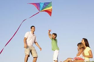 Family flying a kite