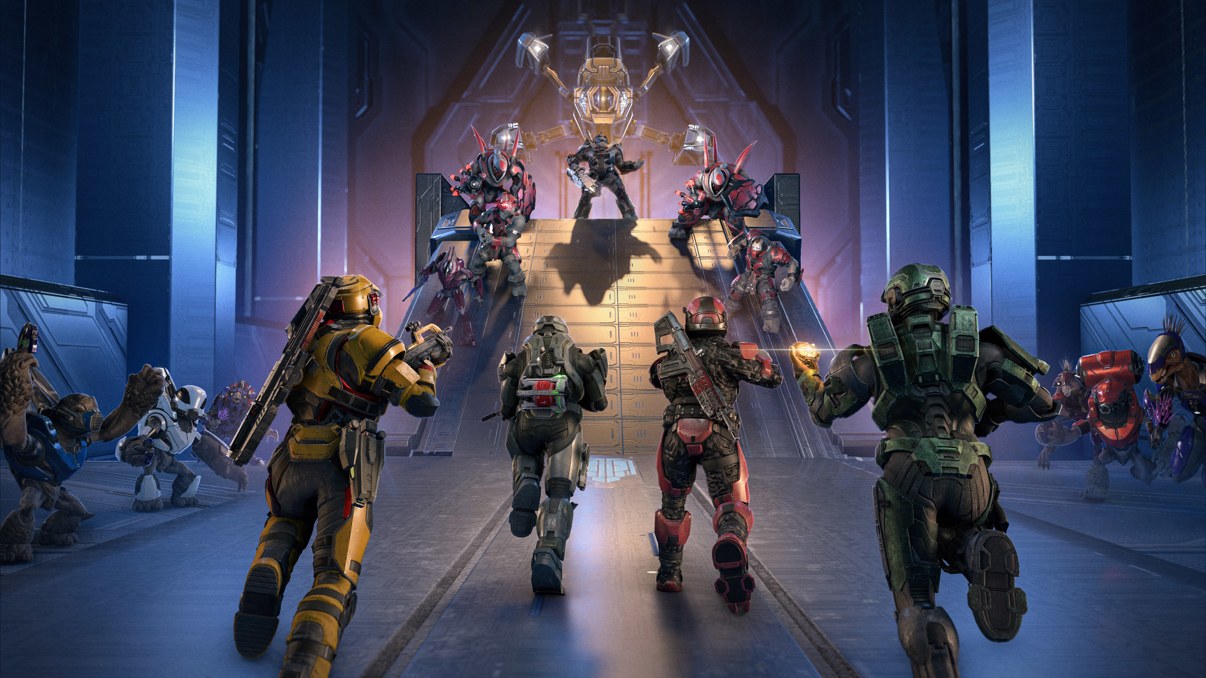 Four Spartans charge up a ramp toward a group of Banished enemies in a Forerunner arena, with a glowing structure looming above as combat unfolds on both sides.