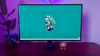 Sony Inzone M10S with green Kiki's Delivery Service Windows 11 wallpaper on screen