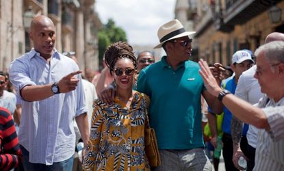 The American royalty tours Old Havana amid guides and bodyguards on April 4. 