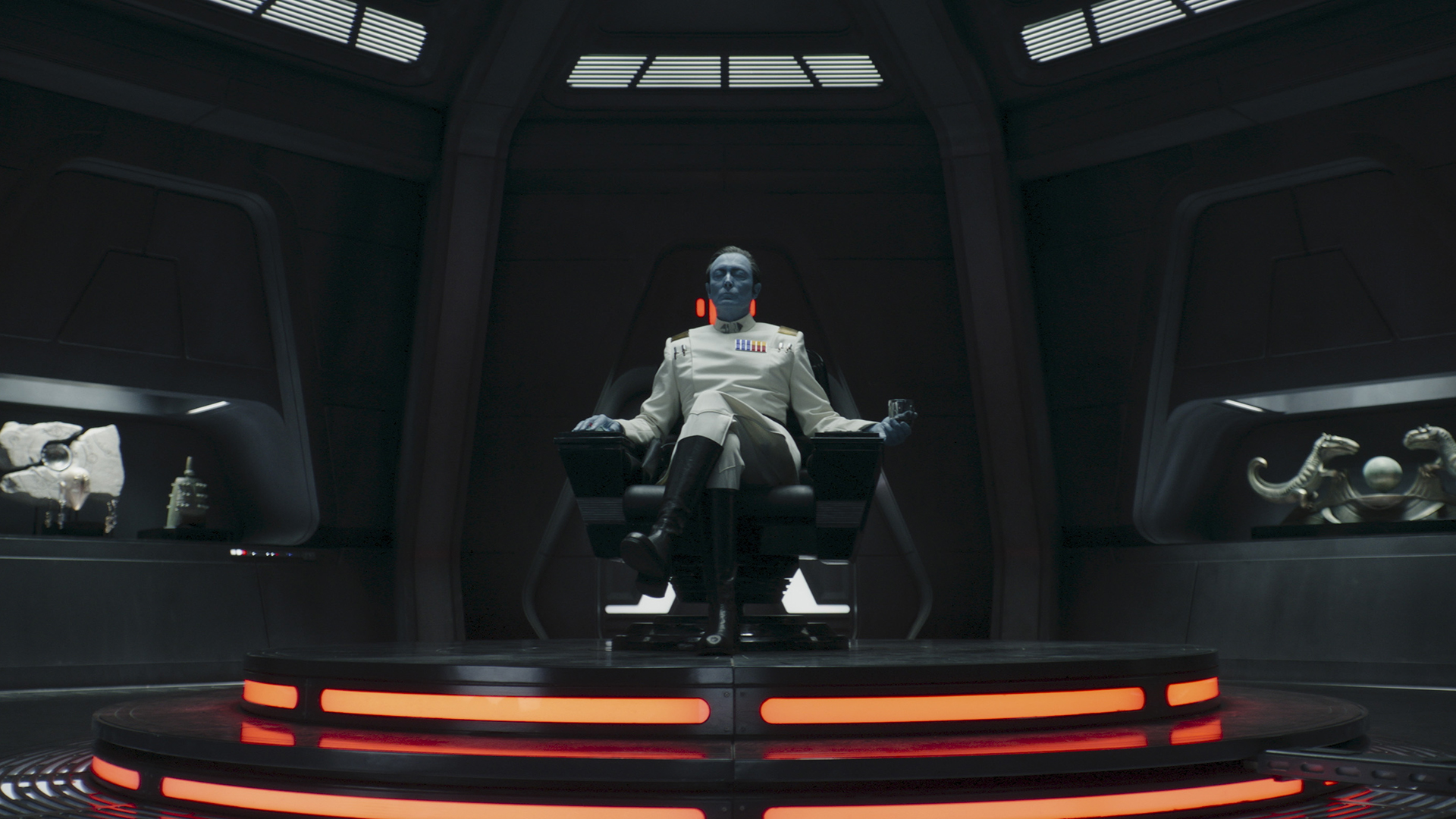 Lars Mikkelsen's Grand Admiral Thrawn sitting in a chair in Star Wars: Ahsoka season 2