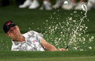 Ryan Moore plays a bunker shot at The Masters