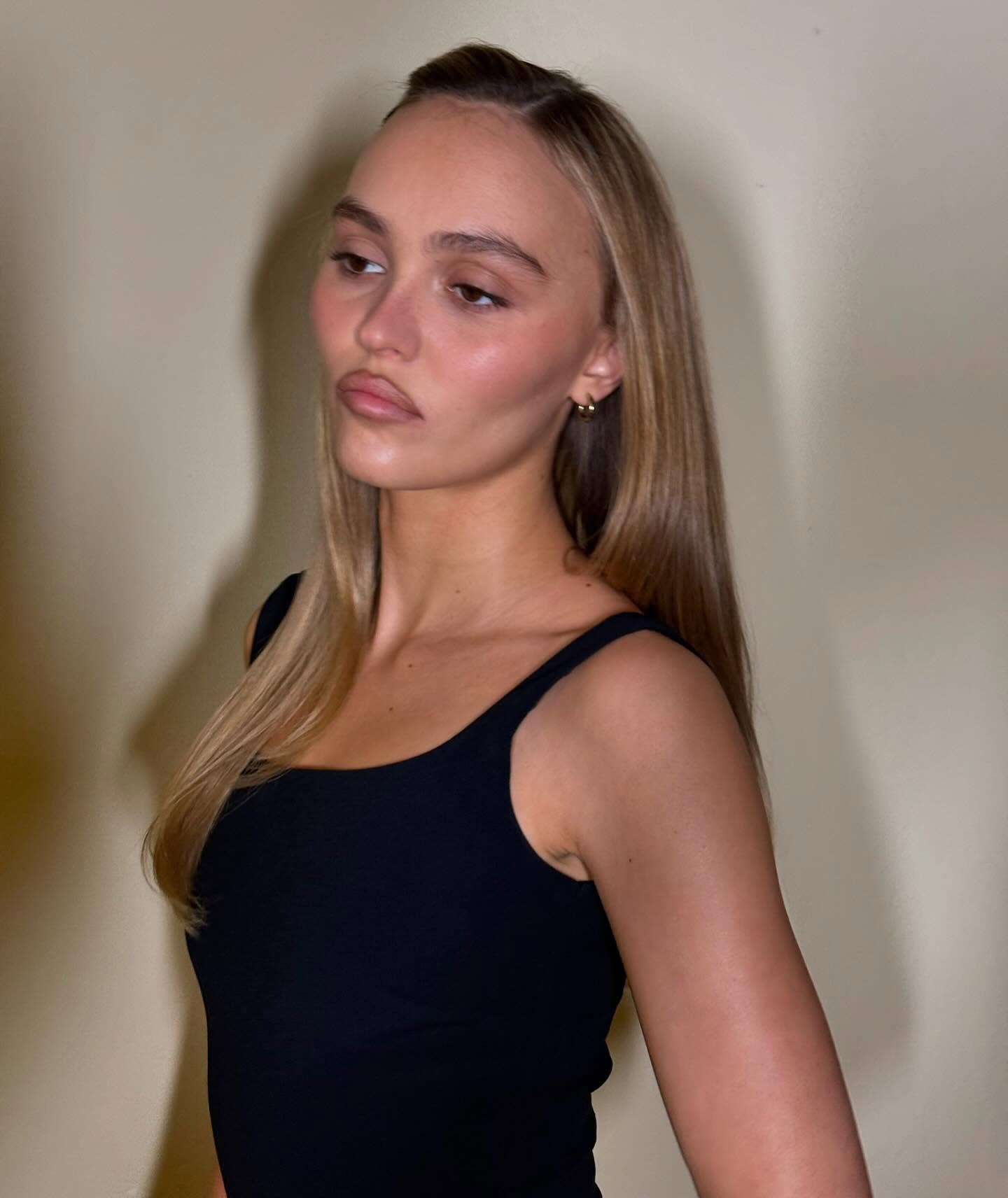 @lilyrose_depp wearing a glowing makeup look with butterscotch blonde hair