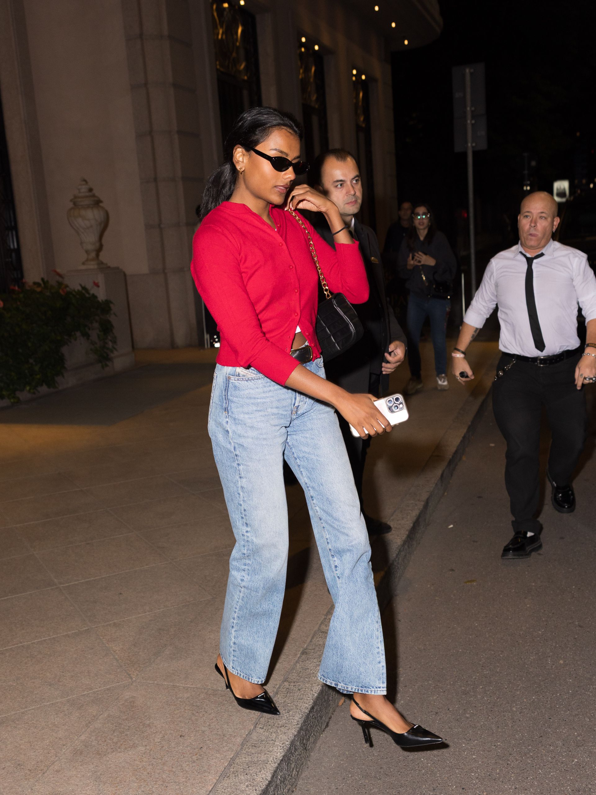 Simone Ashley wearing Prada pumps.