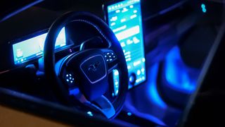 2024 Ford Mustang Mach-E Rally interior at night.