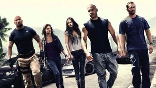 The cast of Fast Five walking towards the camera